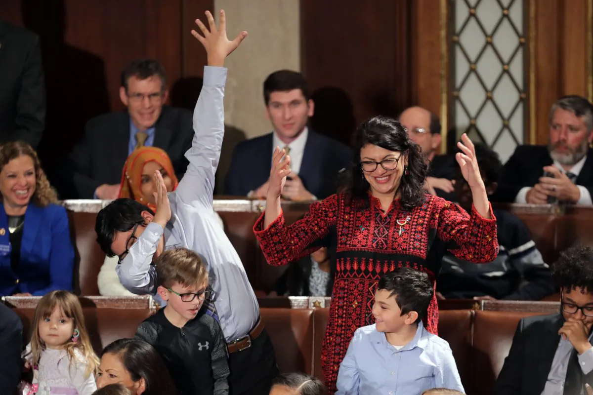 Rep. Rashida Tlaib (D-MI) votes for Speaker-designate Rep. Nancy Pelosi (D-CA) along with her kids during the first session of the 116th Congress at the U.S. Capitol January 03, 2019 in Washington, DC. (Chip Somodevilla/Getty Images)