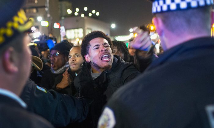 Demonstrators confront police during a protest in Chicago on Nov. 24, 2015. (Scott Olson/Getty Images)
