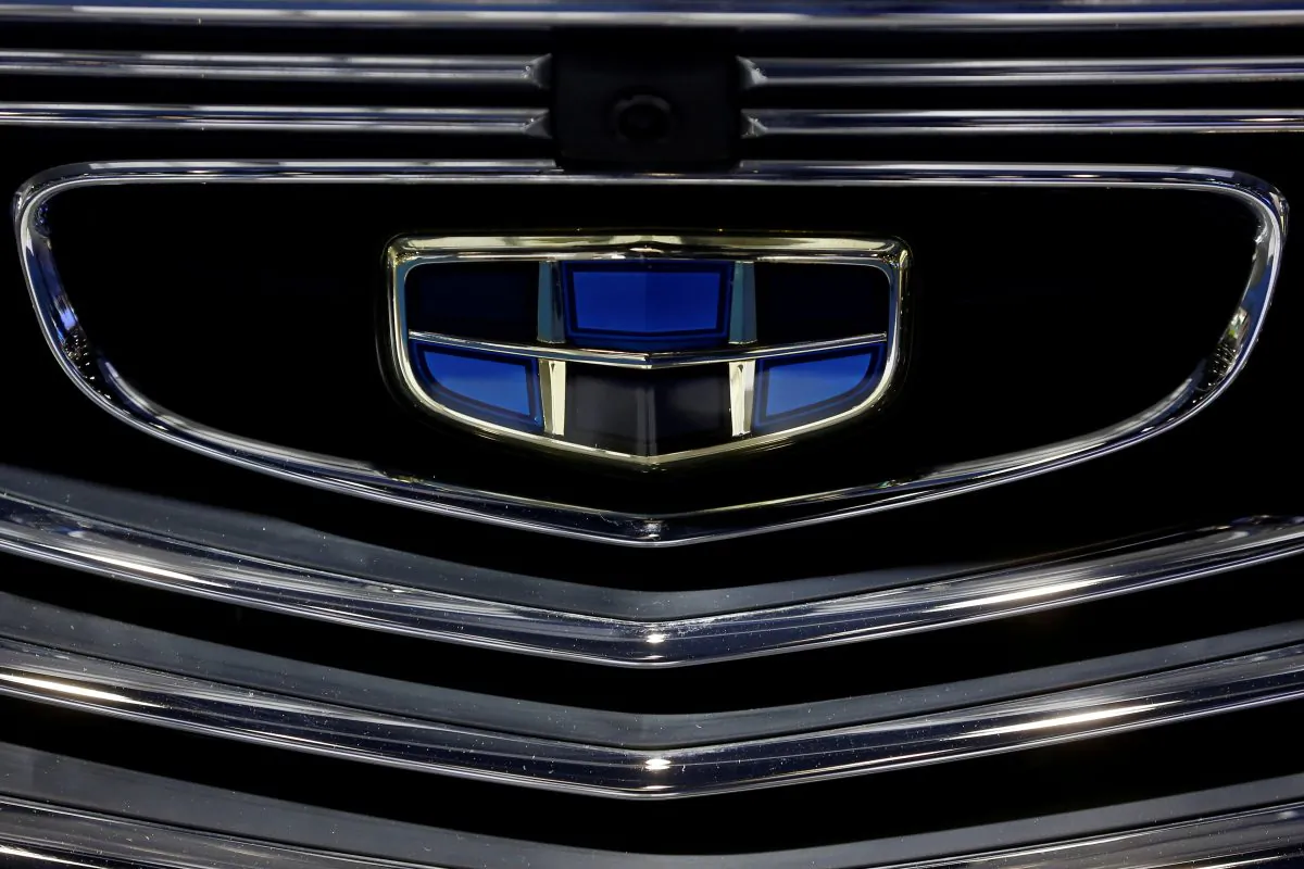 The emblem of the Geely automobile maker logo is seen at the IEEV New Energy Vehicles Exhibition in Beijing, China, on Oct. 18, 2018.  (Thomas Peter/Reuters)