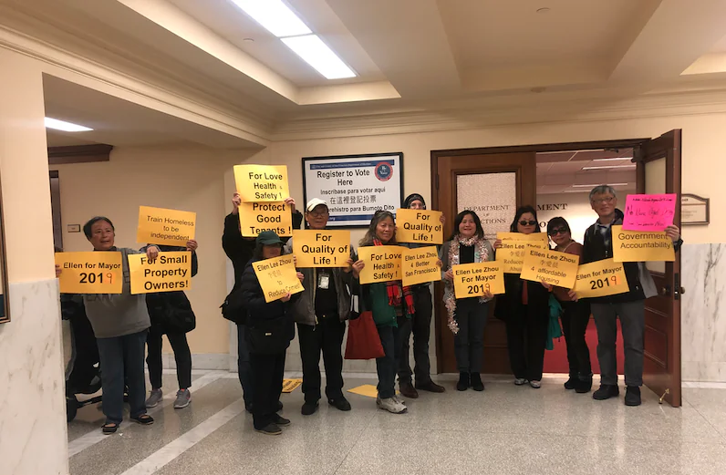 San Francisco mayoral candidate Ellen Lee Zhou (4th from the right) stands with supporters stands in front of the San Francisco election office, having just filed her application to run for mayor, in San Francisco on Jan. 2, 2019. (Nathan Su/The Epoch Times)