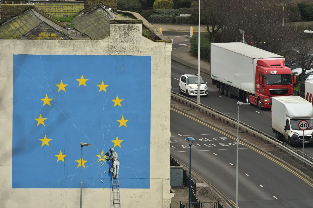 A mural by Banksy depicting a workman chipping away at one of the stars on a European Union-themed flag, in Dover, south east England, on Jan. 7, 2019. (Glyn Kirk/AFP/Getty Images)