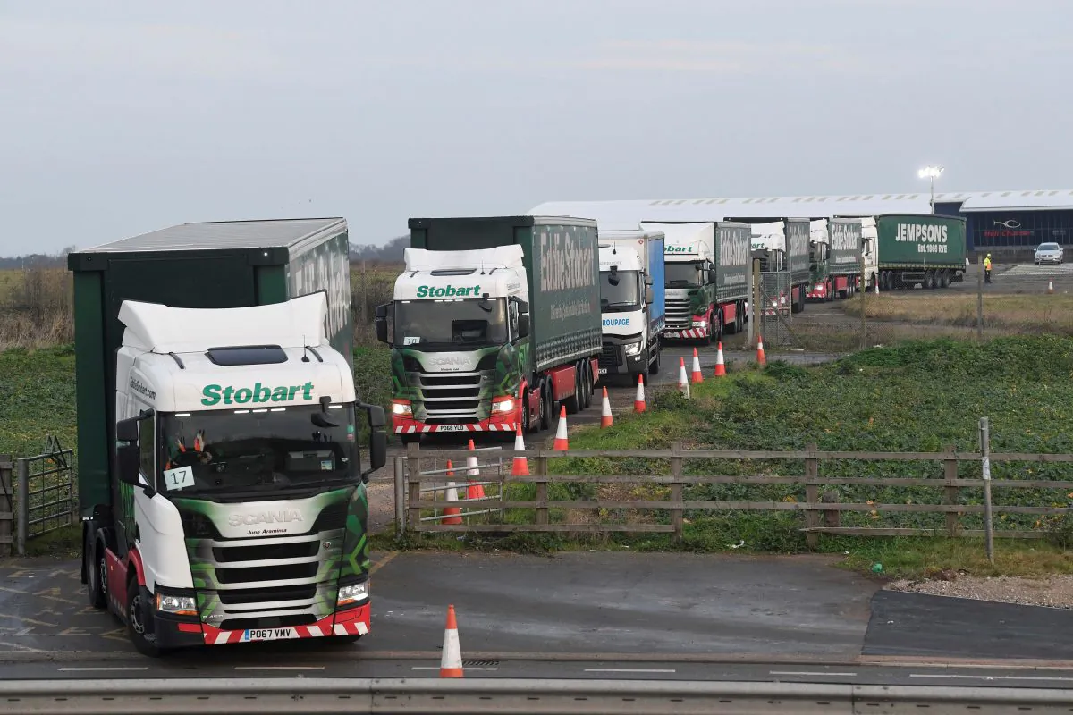 Trucks leave disused Manston Airport to attend a test drive to the Port of Dover during a trial of how roads will cope in the event of a "no-deal" Brexit, in Kent, United Kingdom, on Jan. 7, 2019. (Reuters/Toby Melville)