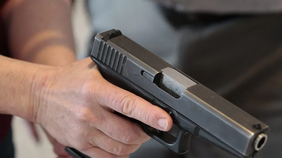 A person holds a gun in a file photo. (George Frey/Getty Images)
