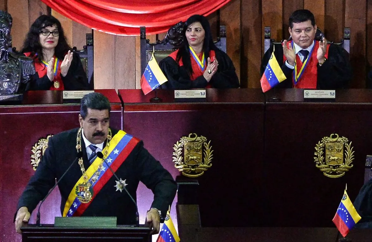 Justice Christian Zerpa (top-R) applauds as Venezuelan President Nicolas Maduro speaks during the opening of the judicial year at the Supreme Court in Caracas, on Feb. 14, 2018.
(Federico Parra/AFP/Getty Images)