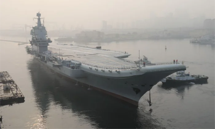 China's first domestically manufactured aircraft carrier, known only as 'Type 001A', leaves port in the northeast city of Dalian early on May 13, 2018. (-/AFP/Getty Images)
