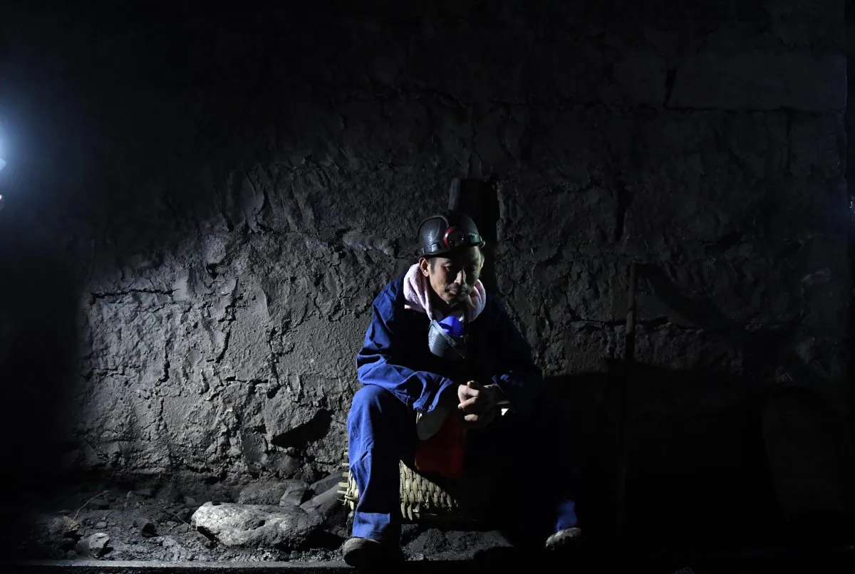A rescuer inside the Jinshangou Coal Mine in Yongchuan District of Chongqing City, China, on Oct. 31, 2016. The missing case files at China's supreme court involved a mining rights legal dispute. (STRINGER/AFP/Getty Images)