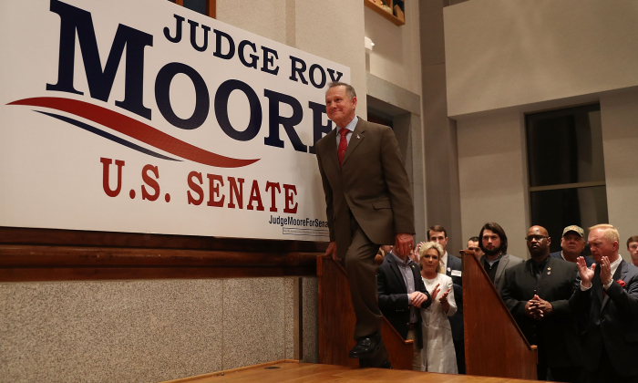 Republican Senatorial candidate Roy Moore arrives on stage to speak about the race against his Democratic opponent Doug Jones  in Montgomery, Alabama, on Dec. 12, 2017. (Joe Raedle/Getty Images)