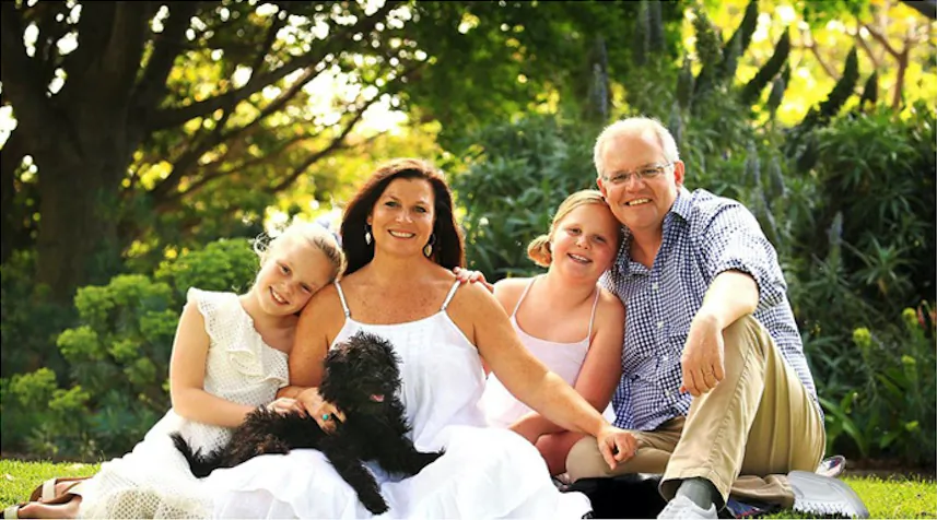 A handout photograph supplied by the Australian Department of Prime Minister and Cabinet shows a doctored version of a portrait of Australian Prime Minister Scott Morrison and his family that shows the political leader with two left shoes. (Department of Prime Minister and Cabinet/Handout/Reuters)