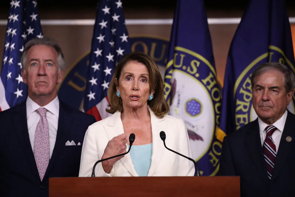 Rep. Richard Neal (D-MA) and Rep. John Yarmuth (D-KY), listen as Democratic Leader Nancy Pelosi (D-CA) speaks during her weekly press conference in the Capitol building on July 20, 2017 in Washington. (Joe Raedle/Getty Images)