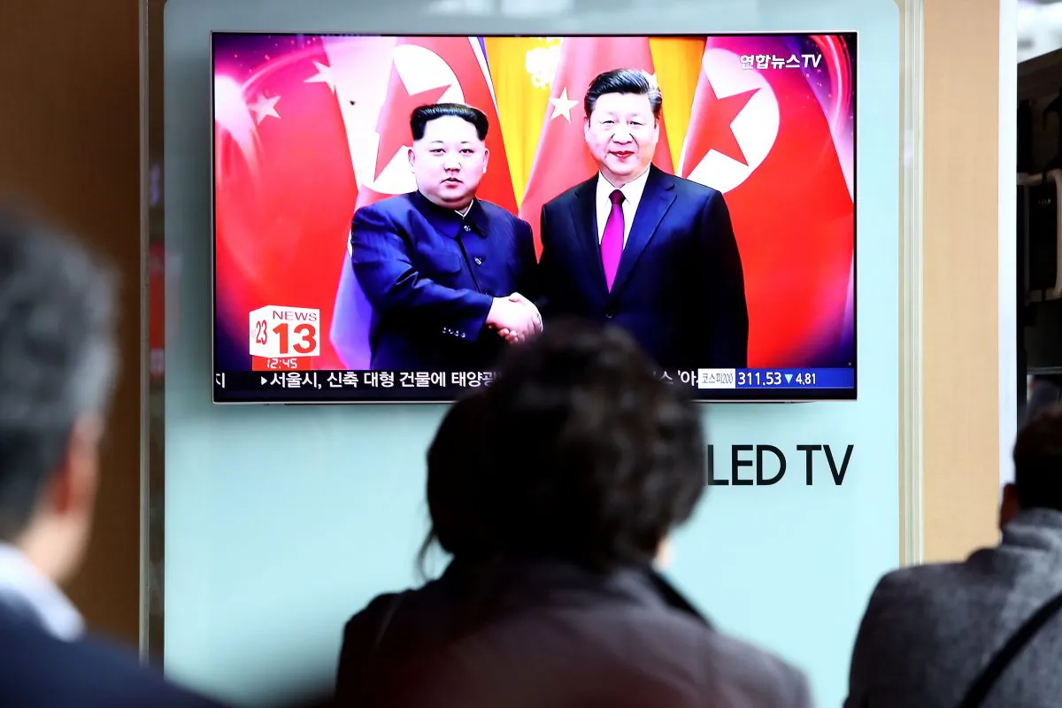 South Koreans watch a television broadcast reporting North Korean leader Kim Jong-un meeting with Chinese leader Xi Jinping at Seoul Railway Station in Seoul, South Korea on March 28, 2018.  (Chung Sung-Jun/Getty Images)