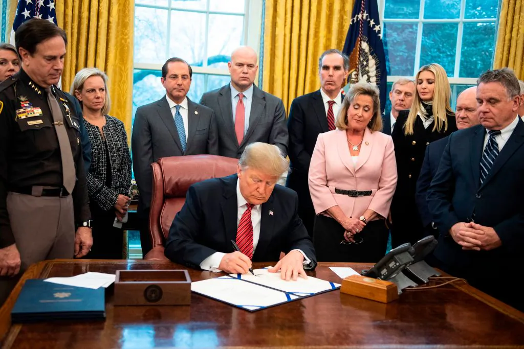 President Donald Trump signs a bill for Anti-Human Trafficking Legislation at White House in Washington, DC, on January 9, 2018. (Jim Watson/AFP/Getty Images)