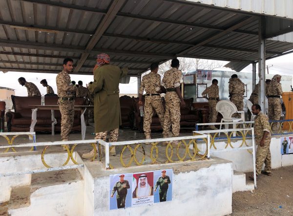 Soldiers inspect the scene