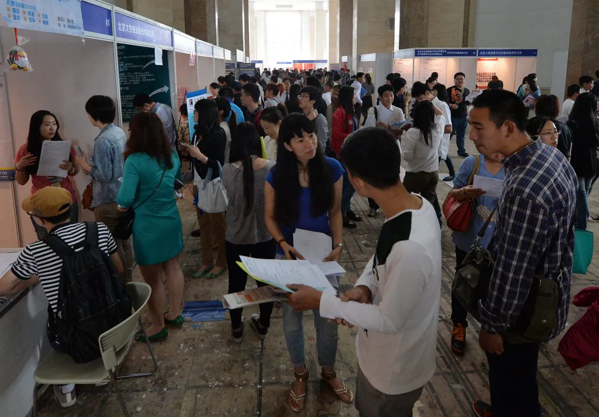 Chinese jobseekers attend a jobs fair in Beijing on May 18, 2013. (Mark Ralston/AFP/Getty Images)