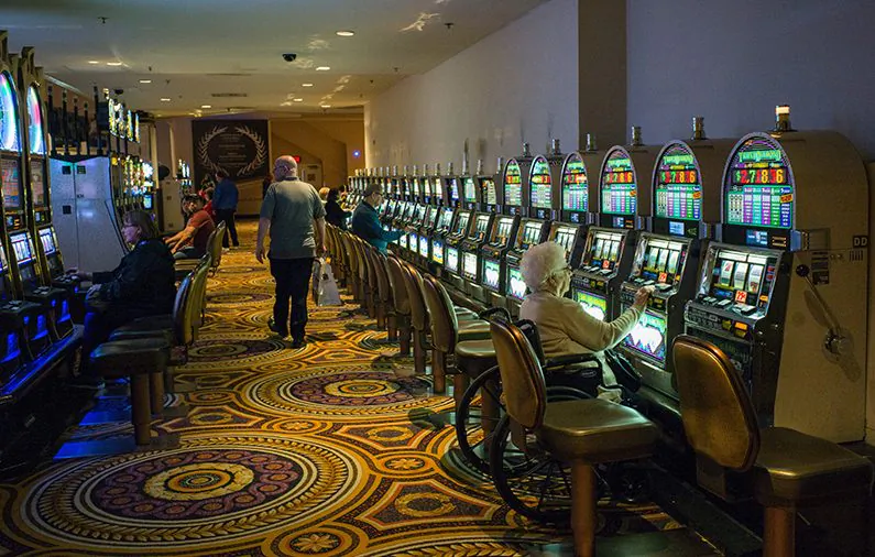 A woman plays the slot machine in a casino in Atlantic City, New Jersey, on May 8, 2016. (Jewel Samad/AFP/Getty Images)