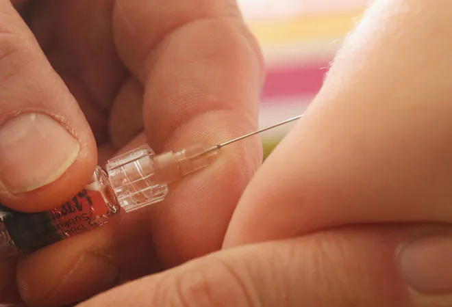 A children's doctor injects a vaccine against measles, rubella, mumps and chicken pox to an infant in Berlin, Germany on Feb. 26, 2015. (Sean Gallup/Getty Images)