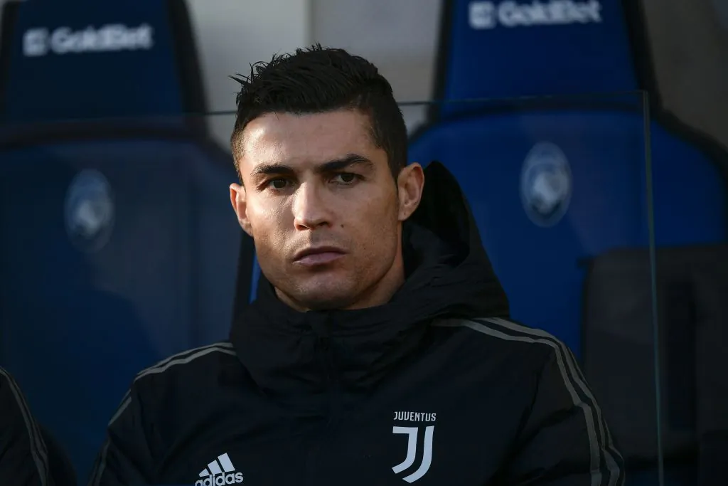 Juventus' Portuguese forward Cristiano Ronaldo looks on from the substitutes' bench prior to the Italian Serie A football Match Atalanta Bergamo vs Juventus on December 26, 2018 at the Atleti Azzurri d'Italia stadium in Bergamo. (Marco BERTORELLO/AFP/Getty Images)