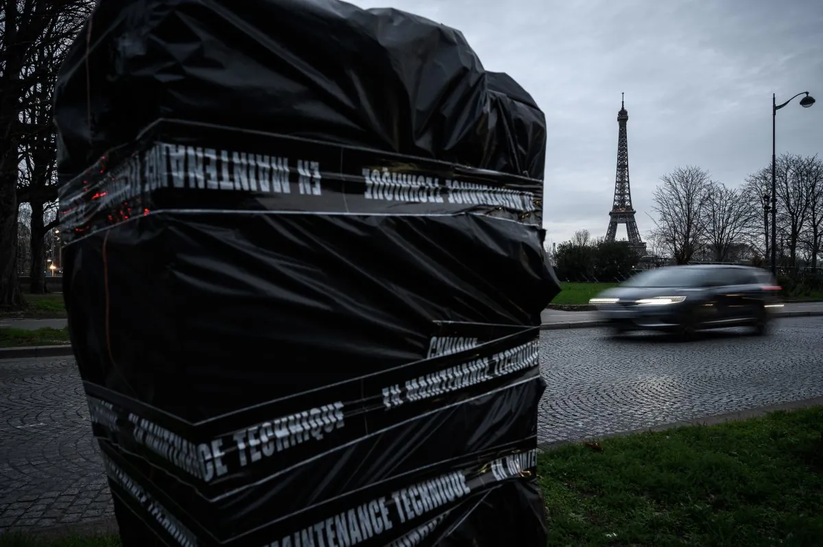 A speed camera in Paris covered by a plastic sheet and tape reading "under technical maintenance," after it was damaged to block its operation. Pictured on Jan. 10, 2019. (Philippe Lopez/AFP/Getty Images)