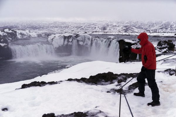 photographs the Godafoss waterfall