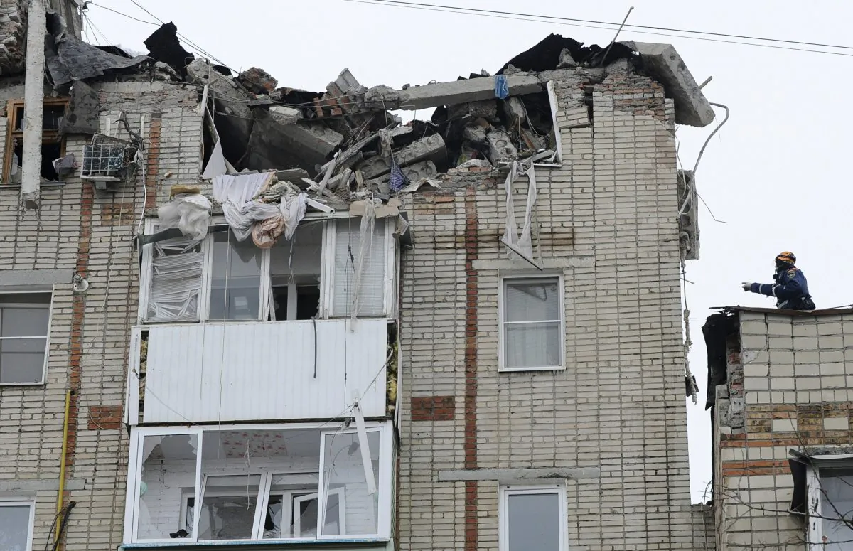 Emergency Situations workers at the scene of the destroyed top floor of a apartment building in the city of Shakhty, Russia, on Jan. 14, 2019. (Photo/AP)