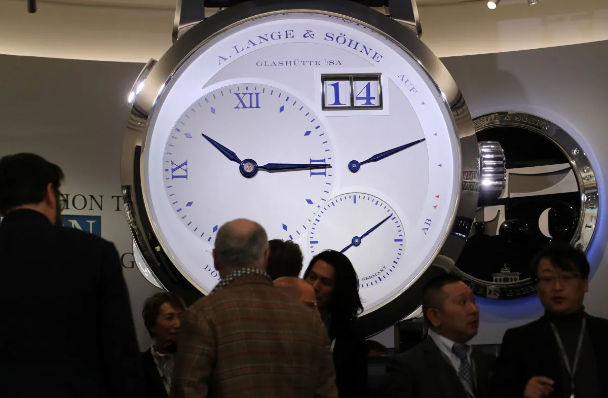 Visitors are pictured on the A. Lange & Soehne stand, part of Richemont luxury group at the "Salon International de la Haute Horlogerie" (SIHH) watch fair in Geneva, Switzerland on Jan. 14, 2019. (Denis Balibouse/Reuters)