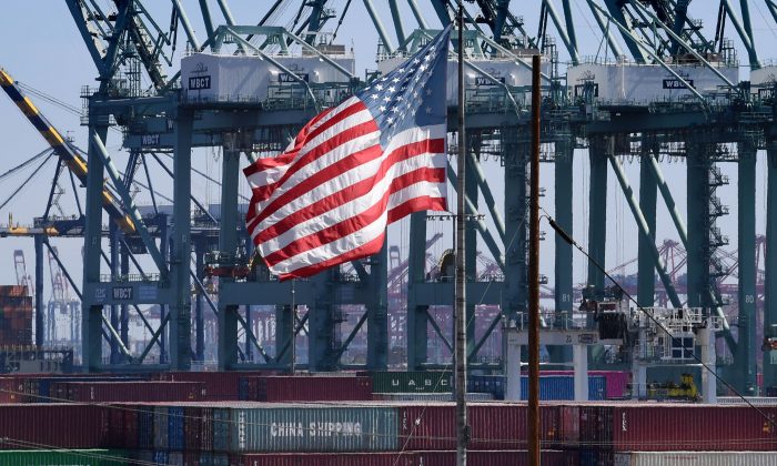 The U.S. flag flies over Chinese shipping containers that were unloaded at the Port of Long Beach, in Los Angeles County, U.S. on Sept. 29, 2018. (Mark Ralston/AFP/Getty Images)