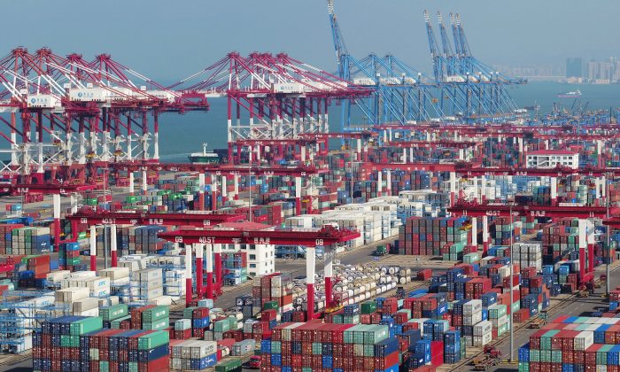 Containers and trucks are seen at a terminal of the Qingdao port in Shandong Province, China on Nov. 8, 2018. (Reuters)