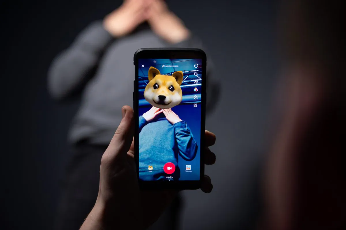 An AFP collaborator poses for a picture using the smart phone application TikTok on Dec. 14, 2018 in Paris. TikTok is a Chinese short-form video-sharing app owned by Bytedance. The Chinese version of the app, Douyin, has more than 300 million domestic monthly active users, according to the company. (-/AFP/Getty Images)