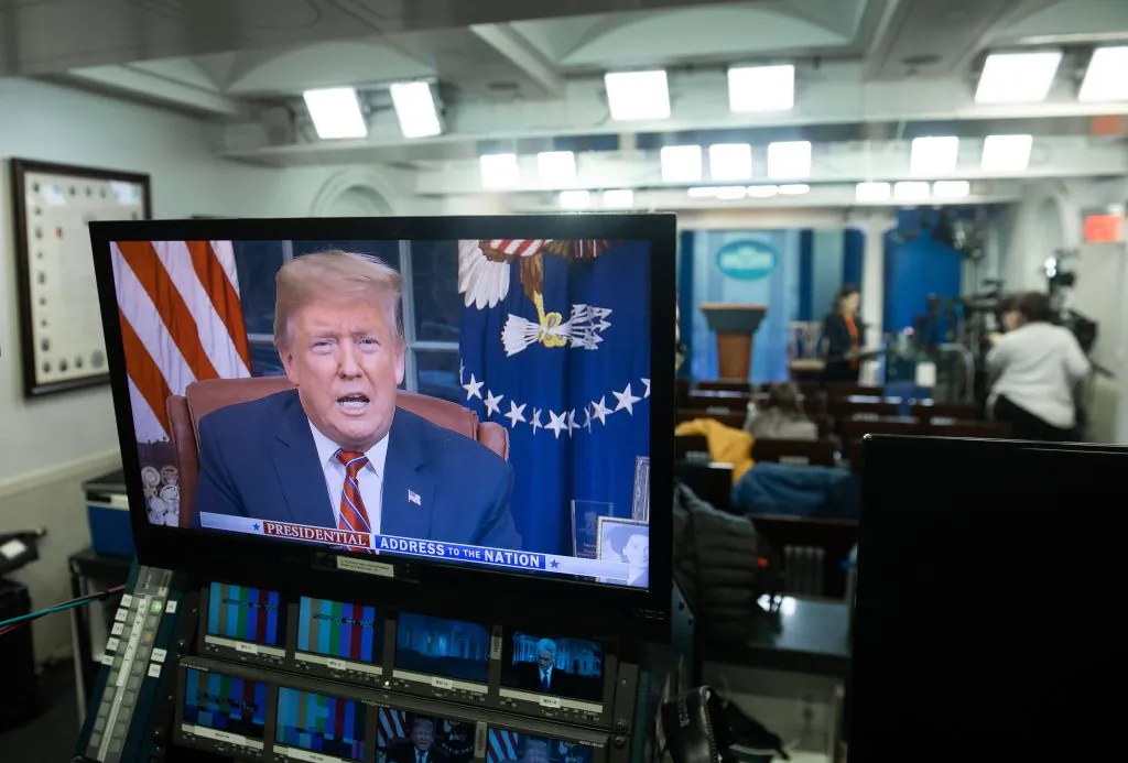 President Donald Trump appears on a television screen in the Press Briefing Room of the White House in Washington on Jan. 8, 2019, as he speaks during a presidential address about the government shutdown and border security from the Oval Office. (Saul Loeb/AFP/Getty Images)