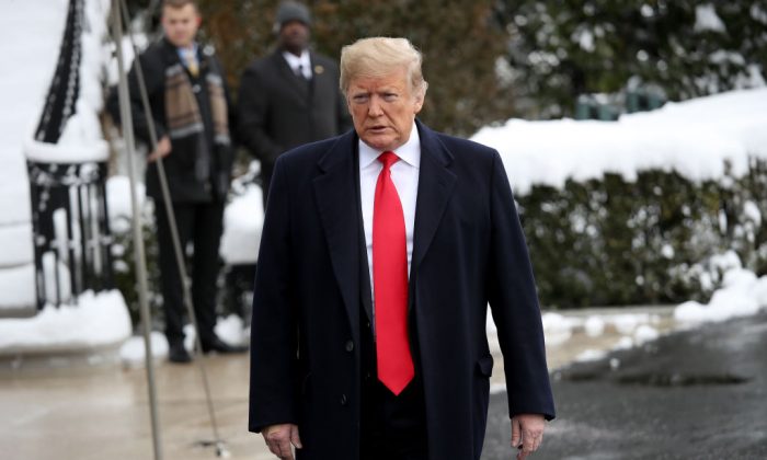 President Donald Trump arrives to answer questions from reporters as he departs the White House in Washington, on Jan. 14, 2019. (Win McNamee/Getty Images)