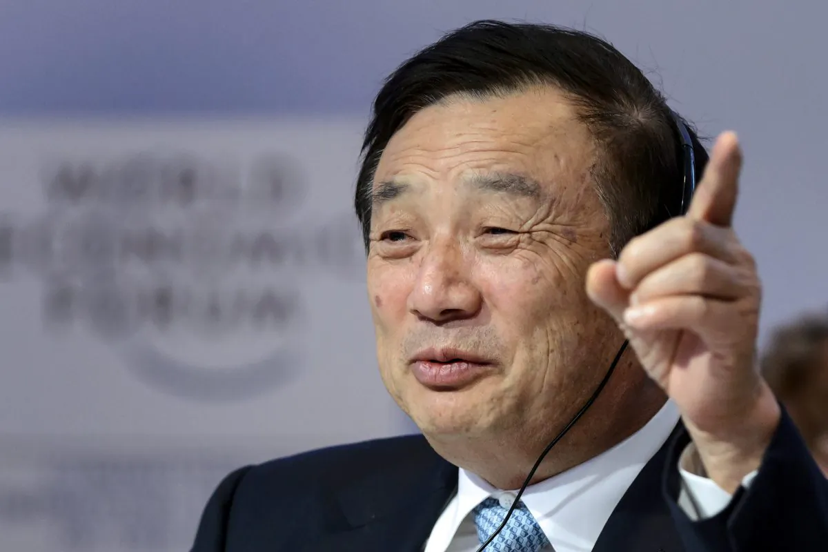 Huawei Founder and CEO Ren Zhengfei gestures as he attends a session of the World Economic Forum (WEF) annual meeting on Jan. 22, 2015 in Davos. (AFP photp/ Fabrice Coffrini)