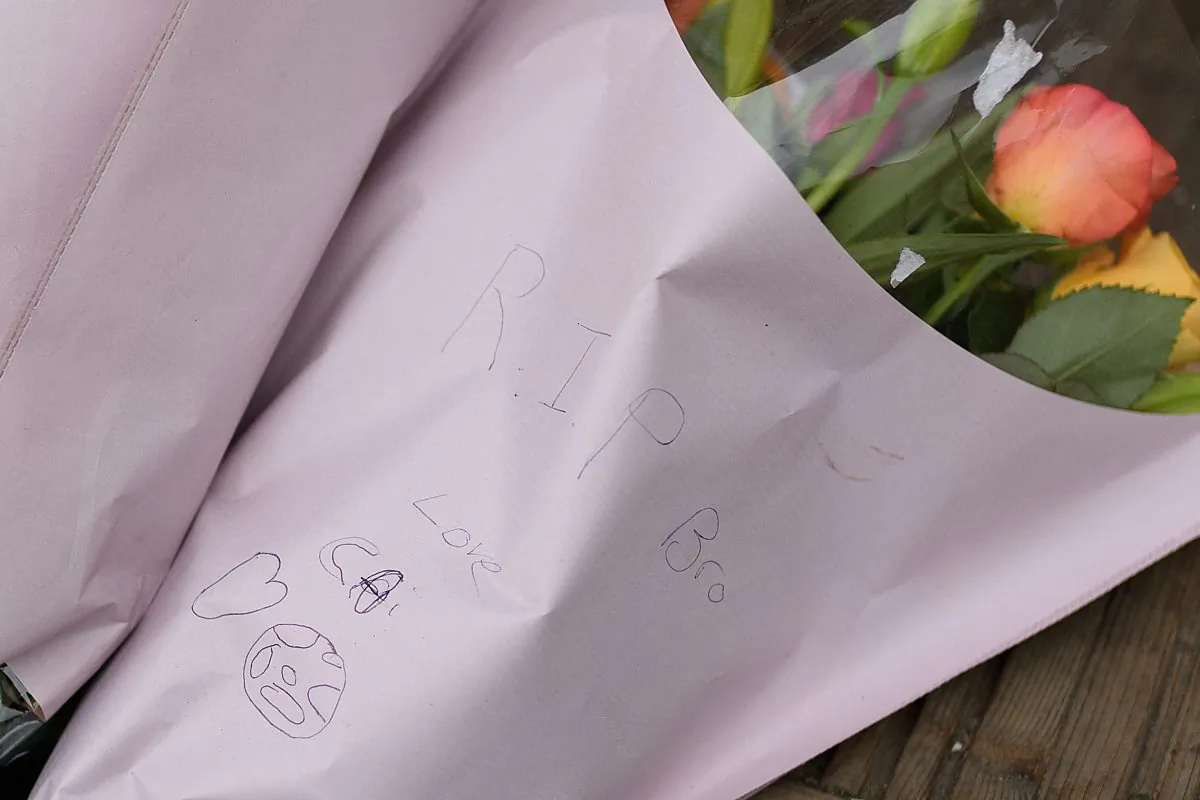 Flowers with a card reading "R.I.P. Bro" is seen near to where the murder of 14-year-old Jayden Moody took place, on Jan. 09, 2019, in London, England. (Leon Neal/Getty Images)