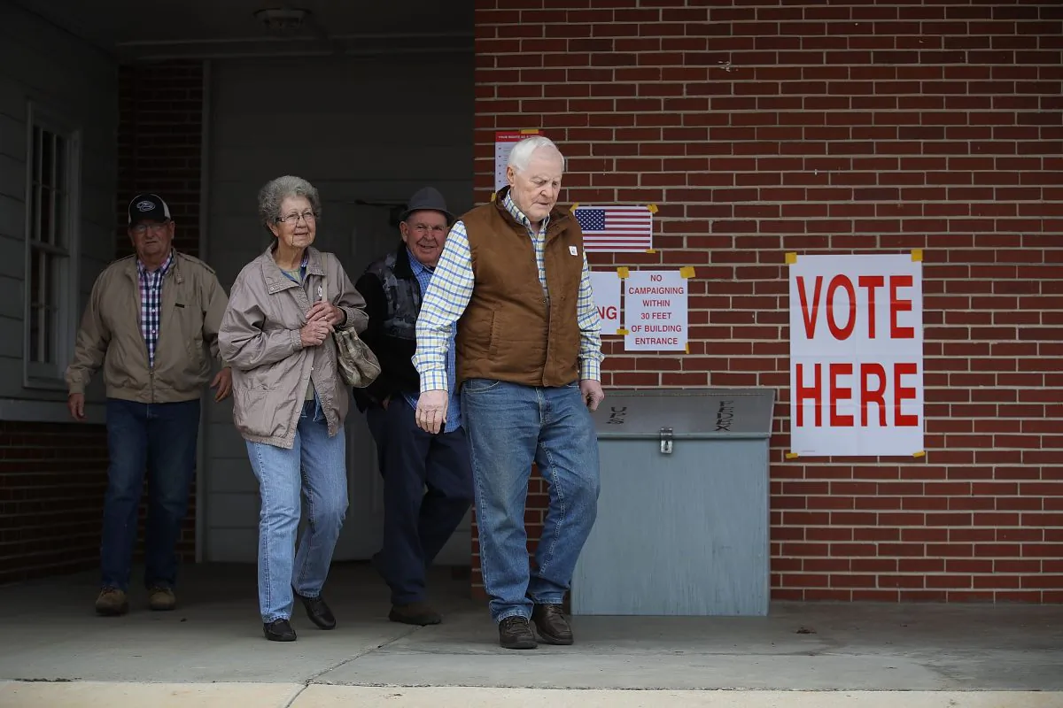 Voters exit after casting their ballots at a polling station setup in the Fire Department in Gallant, Alabama, on Dec. 12, 2017. (Joe Raedle/Getty Images)