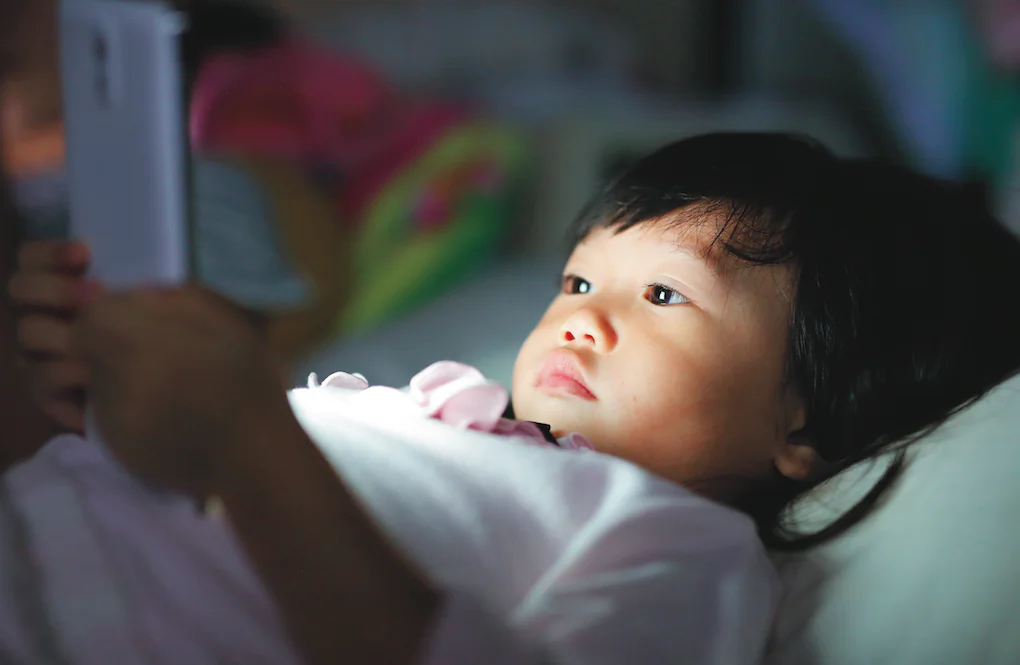 Emerging research shows screen usage actually impedes the development of basic abilities like building vocabulary. (GOLFX/Shutterstock)