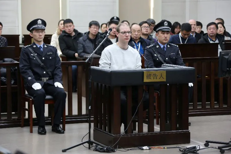 Canadian Robert Lloyd Schellenberg appears in court for a retrial of his drug smuggling case in Dalian, Liaoning province, China, on Jan. 14, 2019. (Handout via REUTERS)