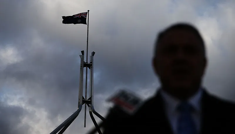 File photo of silhouette of an Australian politician in front of Australia’s Parliament House in Canberra. (Stefan Postles/Getty Images)