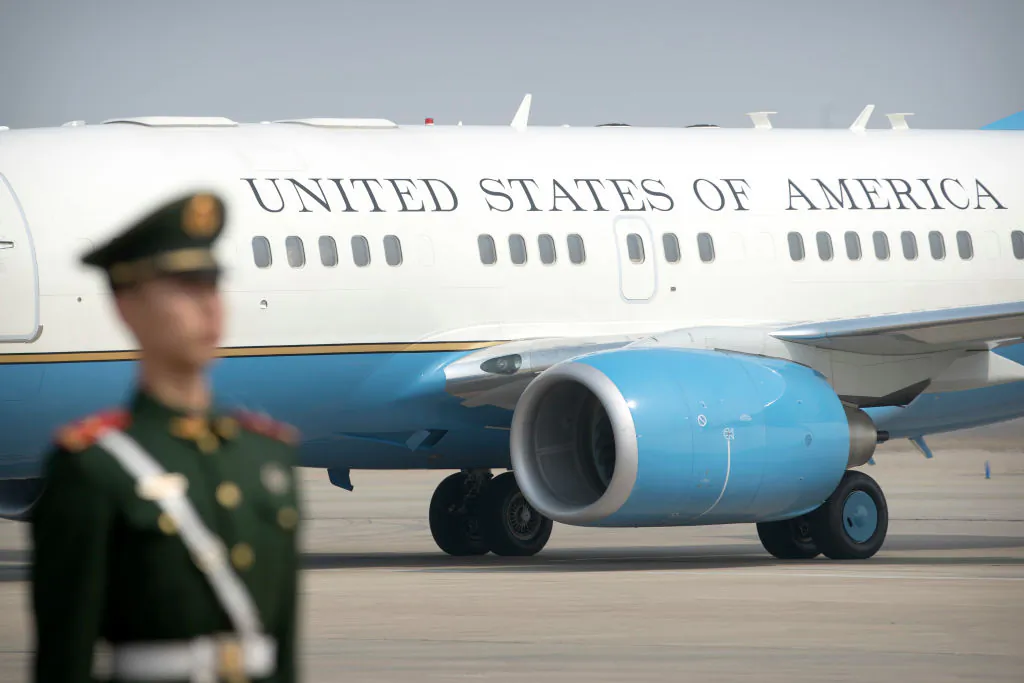 A Chinese paramilitary policeman stands guard as a  U.S. plane arrives at Beijing Capital International Airport on March 18, 2017. (Mark Schiefelbein/AFP/Getty Images)