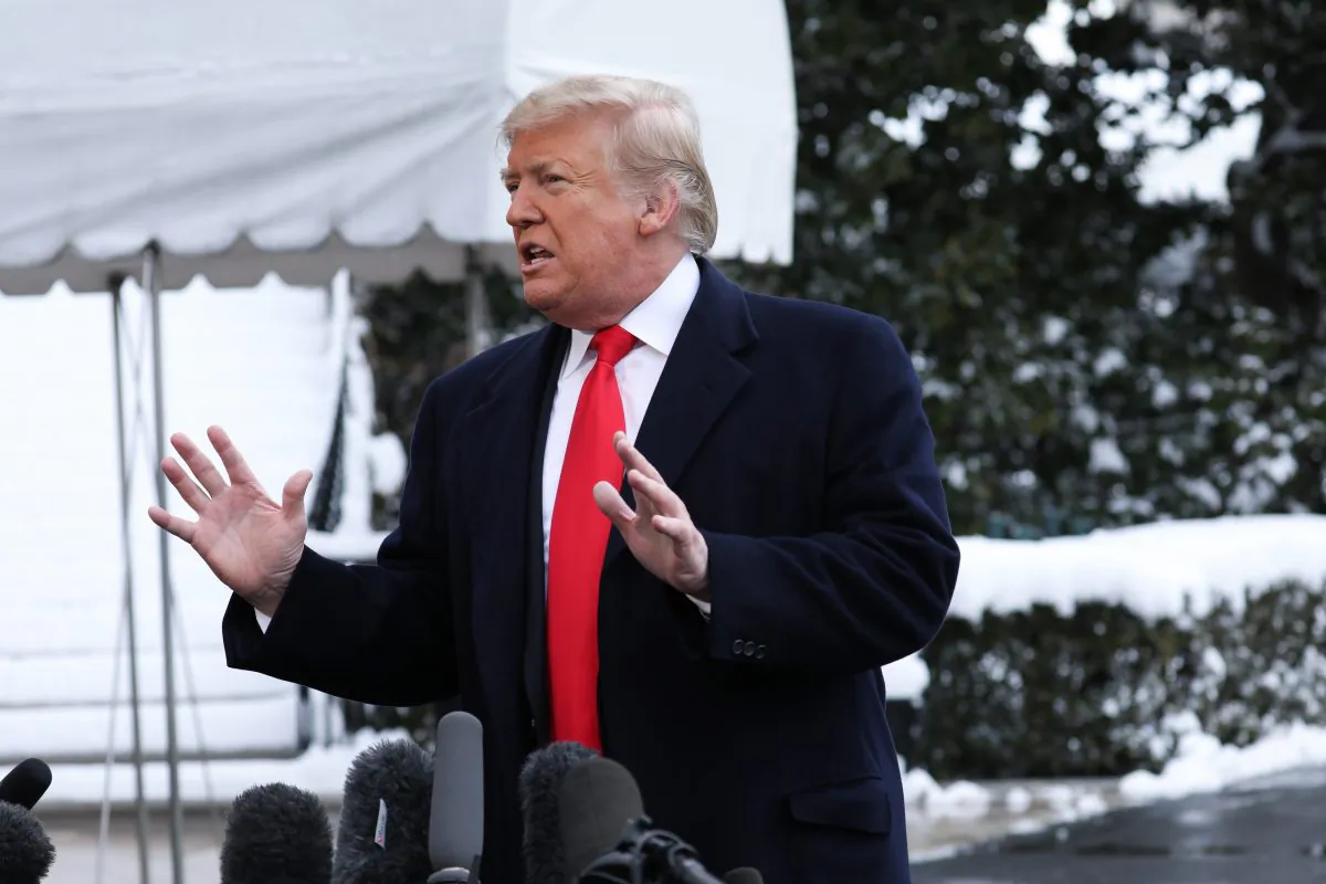 President Donald Trump speaks to reporters on the South Lawn of the White House in Washington on Jan. 14, 2019. (Holly Kellum/NTD)