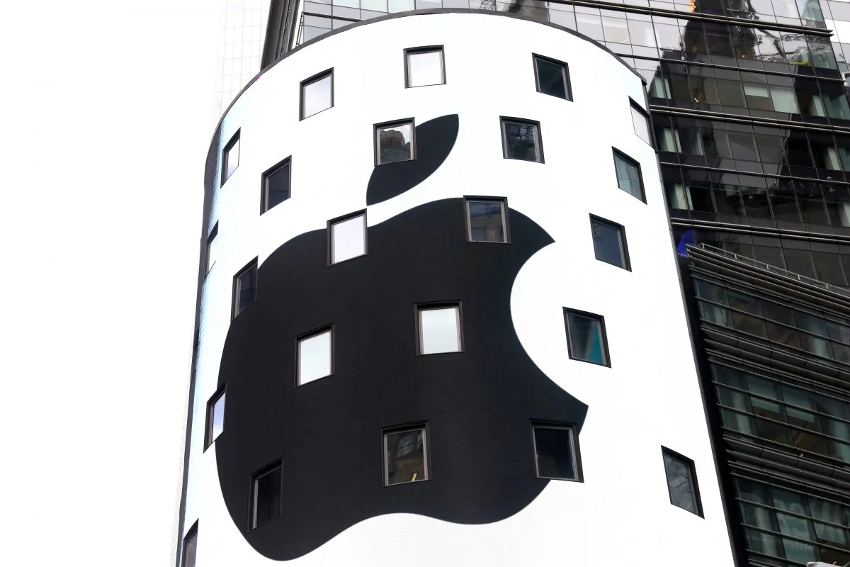 An electronic screen displays the Apple Inc. logo on the exterior of the Nasdaq Market Site following the close of the day's trading session in New York City on Aug. 2, 2018. (Mike Segar/Reuters)