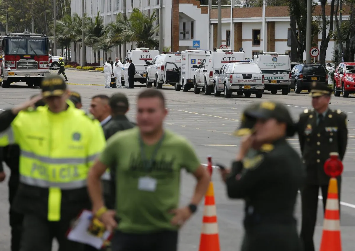 In this image provided by military personnel, emergency personnel respond to the scene of a deadly car bombing at a police academy on Thursday, Jan. 17, 2019, in Bogota, Colombia. (AP Photo)