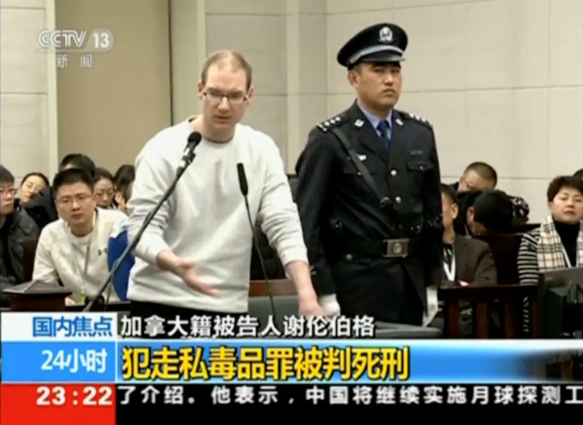 A still image taken from CCTV video shows Canadian Robert Lloyd Schellenberg in court, where he was sentenced with a death penalty for drug smuggling, in Dalian, Liaoning province, China, on Jan. 14, 2019. (CCTV via Reuters)