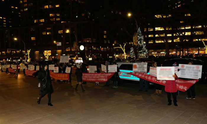 Protesters with a Beijing front group stand in front of Lincoln Center in New York on Jan. 10, 2019. (Cathy He/The Epoch Times)
