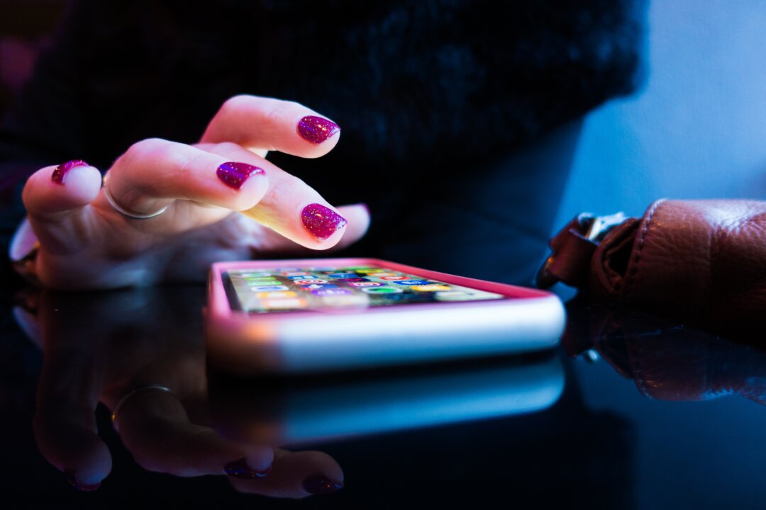 Our constant cell phone usage is raising our exposure to potentially damaging EMF radiation. (Unsplash)