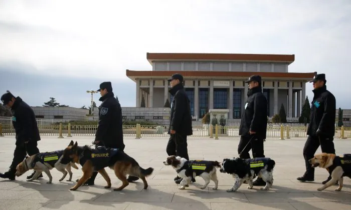 Police walk sniffer dogs outside the Great Hall of the People during the Closing Session of the Chinese People's Political Consultative Conference (CPPCC) in Beijing, China on March 15, 2018. (Thomas Peter/Reuters)