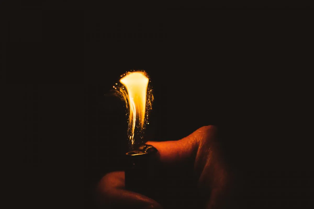 A lighter flame sparks into life. (Pixabay) 