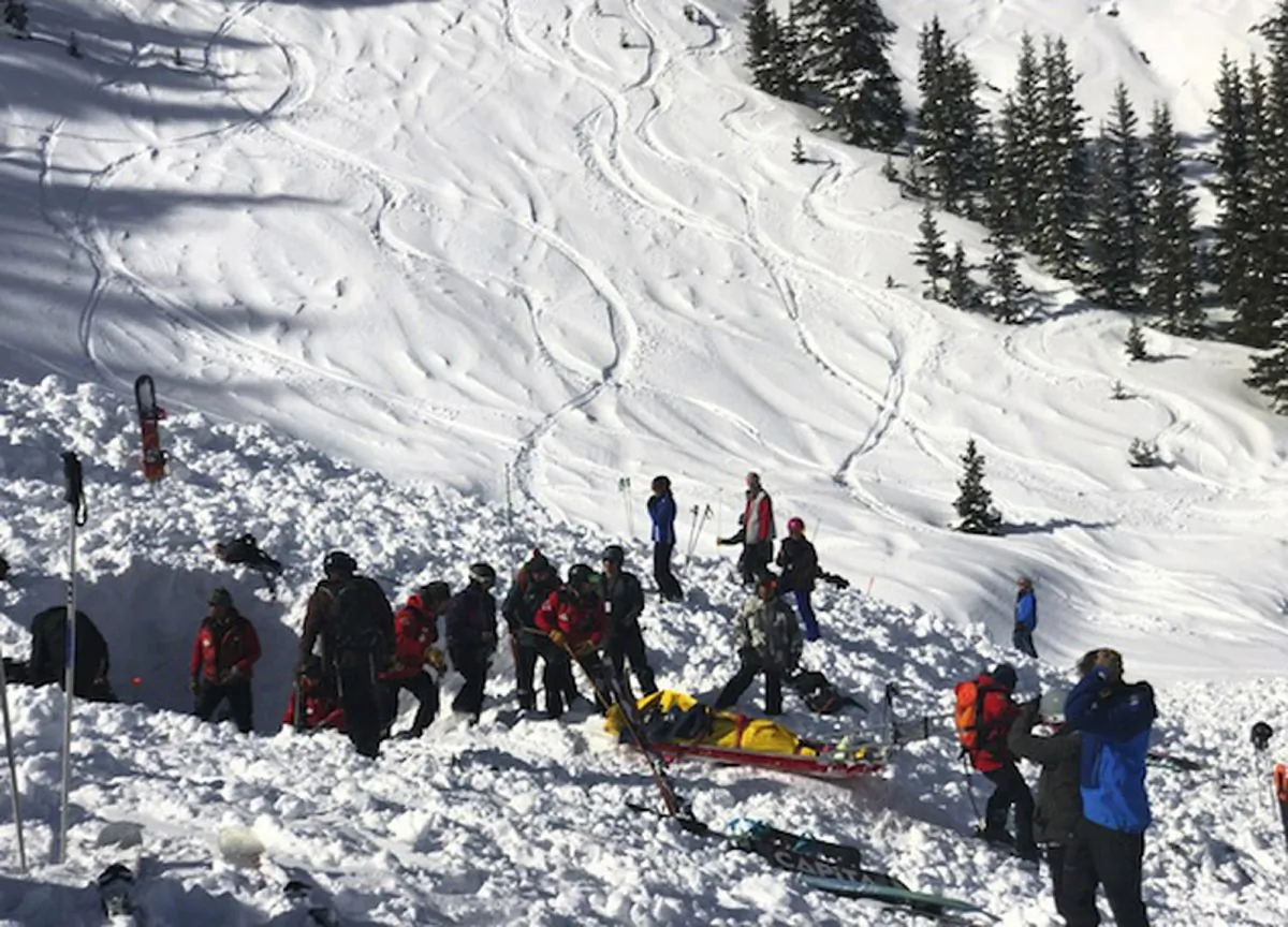 People search for victims after an avalanche buried a number of people near the highest peak of Taos Ski Valley, one of the biggest resorts in New Mexico, Jan. 17, 2019. (Morgan Timms/Taos News via AP)