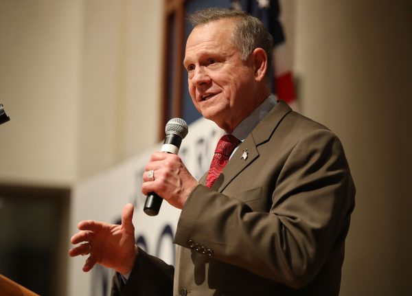 Roy Moore speaking with microphone in hand