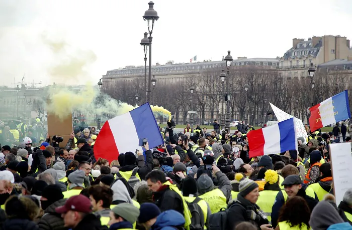 Protesters wearing yellow vests take part in a demonstration by the "yellow vests" movement, in Paris, France, on Jan. 19, 2019. (Charles Platiau/Reuters)