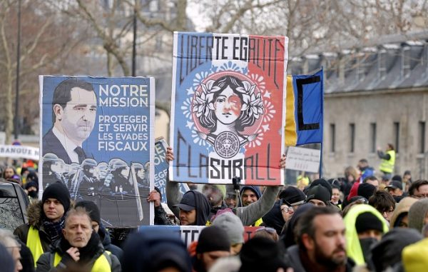 Protesters wearing yellow vests take part in a demonstration by the "yellow vests" movement, in Paris