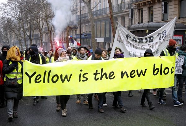 Protesters wearing yellow vests take part in a demonstration by the "yellow vests" movement, in Paris