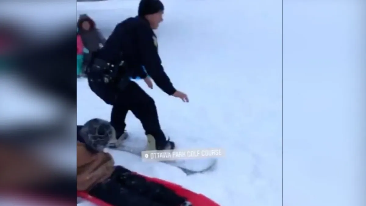A police officer in Toledo, made the most of a winter storm hitting the state by getting snowboarding tips. Ohio, Jan. 19 (Toledo Police Department)